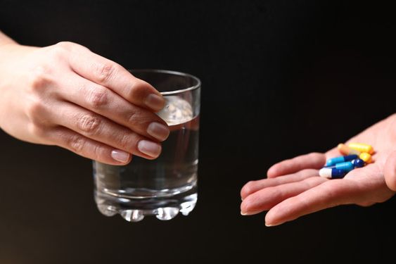 A glass of water and medical pills in the... |  #freepik #freephoto #water #hand #medical #hands Free Photo